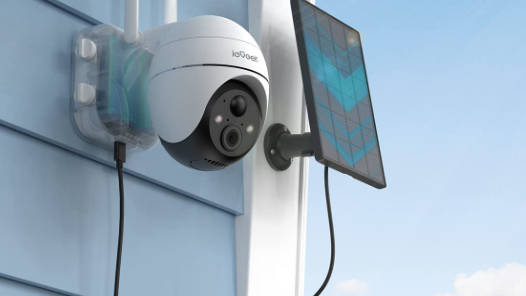 a solar powered security camera outside a property